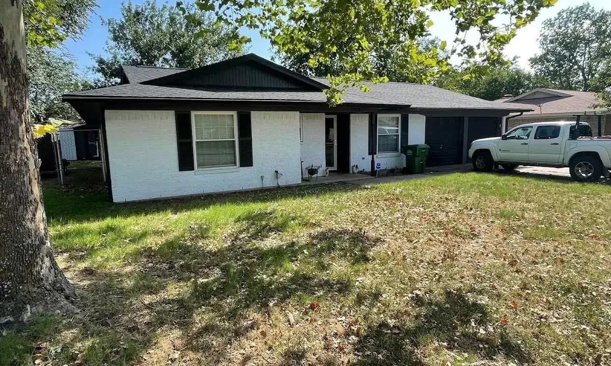 Professional roofing crew working on a residential roof in Detroit